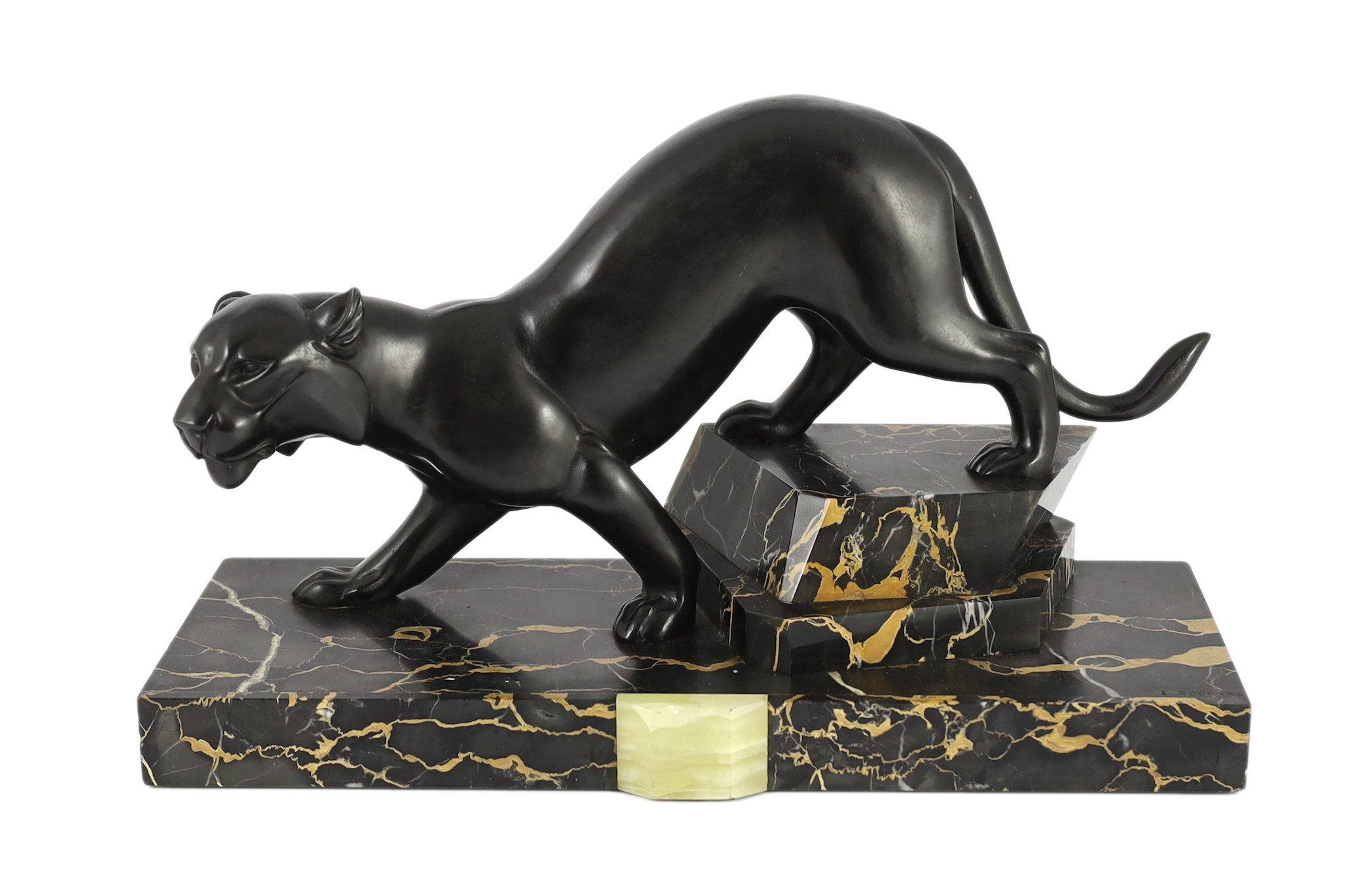 Irene Rochard. A French Art Deco bronzed spelter and marble model of a black panther, 44cm wide, 27cm high